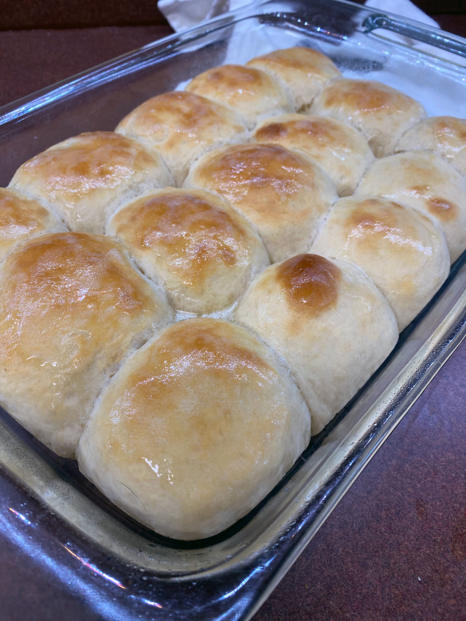 Freshly baked dinner rolls on counter